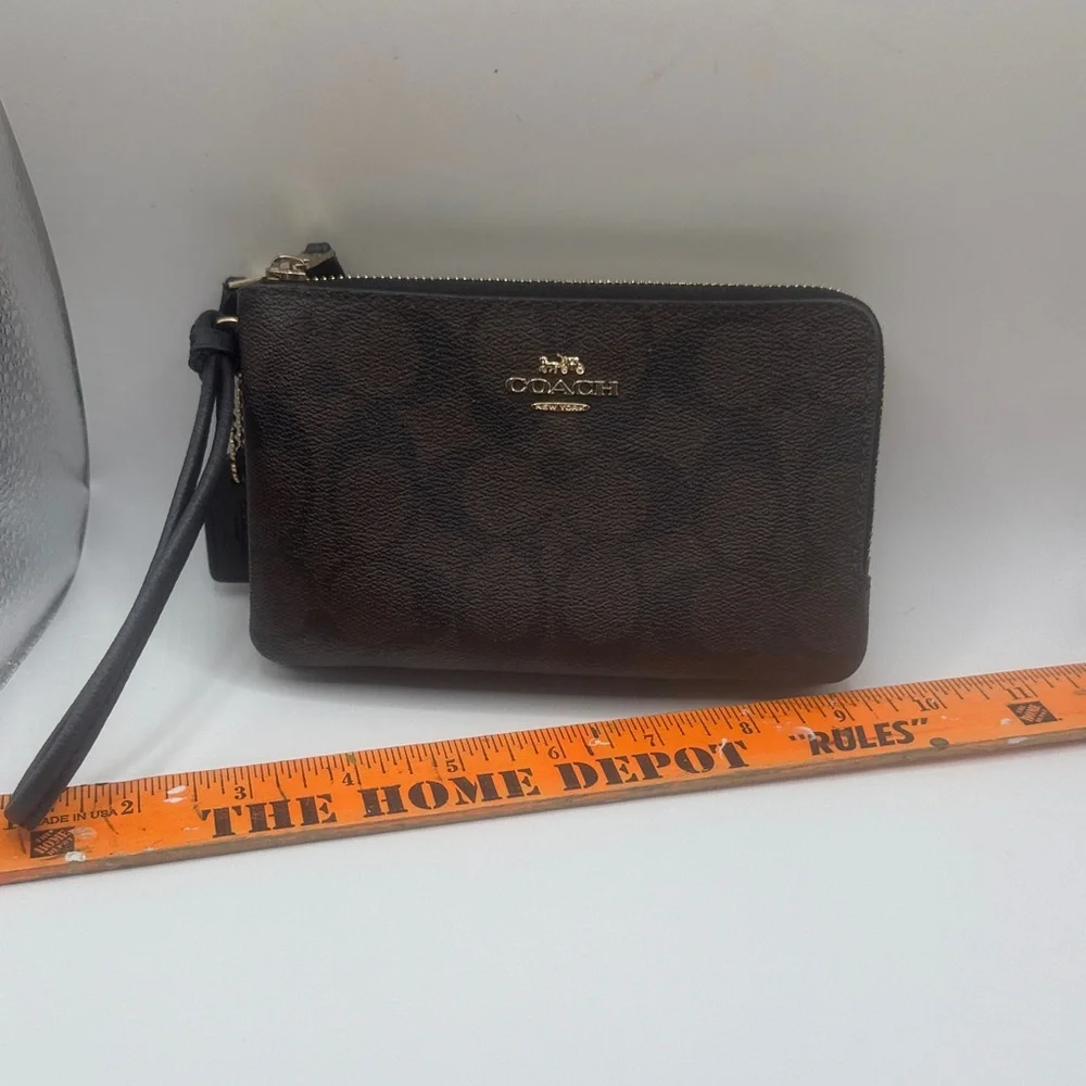 Coach signature‎ Brown Wristlet with Black and gold Accents